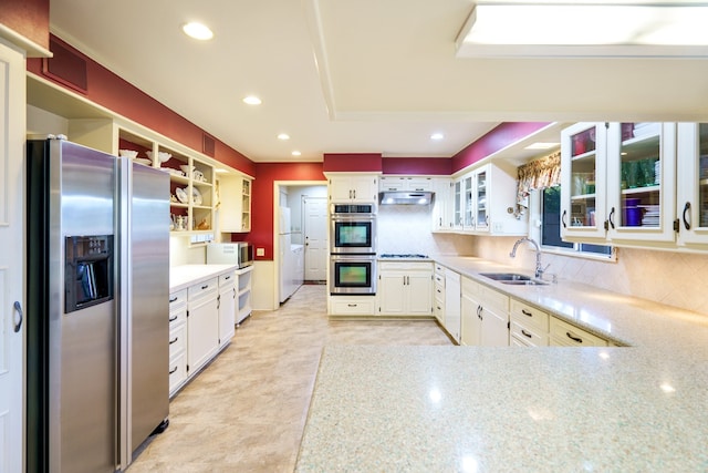 kitchen with white cabinetry, appliances with stainless steel finishes, and sink