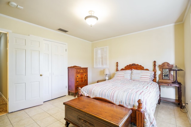 tiled bedroom with a closet and ornamental molding