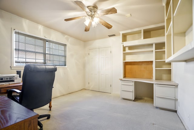 office featuring light carpet and ceiling fan