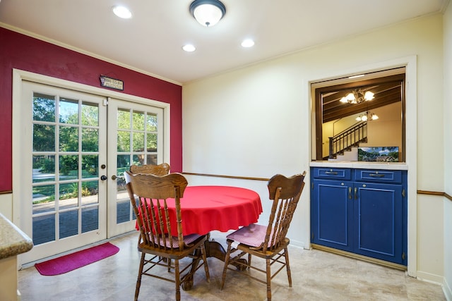 dining space featuring crown molding and french doors