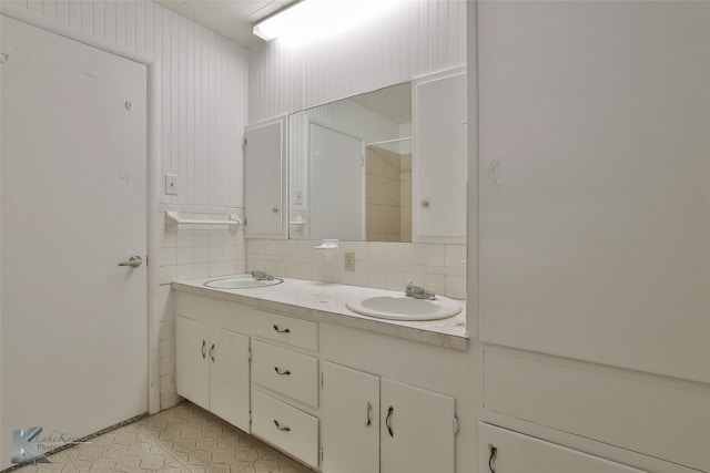 bathroom featuring backsplash and vanity