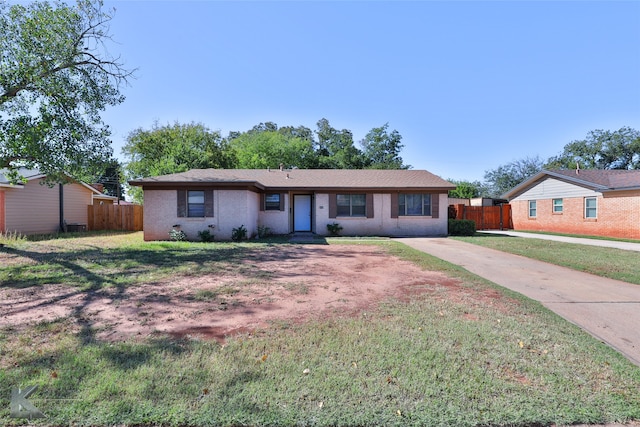 ranch-style house featuring a front lawn