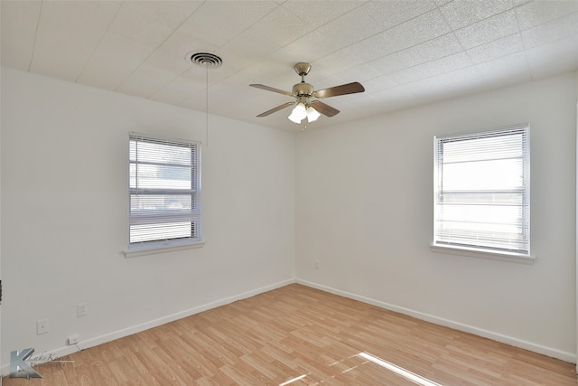 unfurnished room with ceiling fan and light hardwood / wood-style flooring