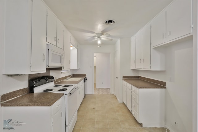 kitchen with light tile patterned flooring, sink, ceiling fan, white appliances, and white cabinets