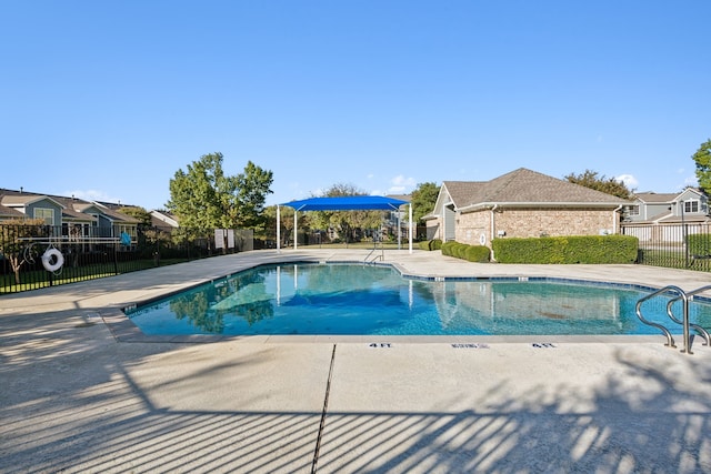 view of swimming pool with a patio