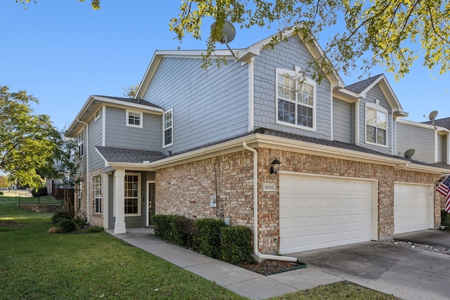 view of front facade with a garage and a front yard