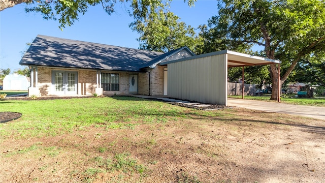 ranch-style house with a carport and a front yard