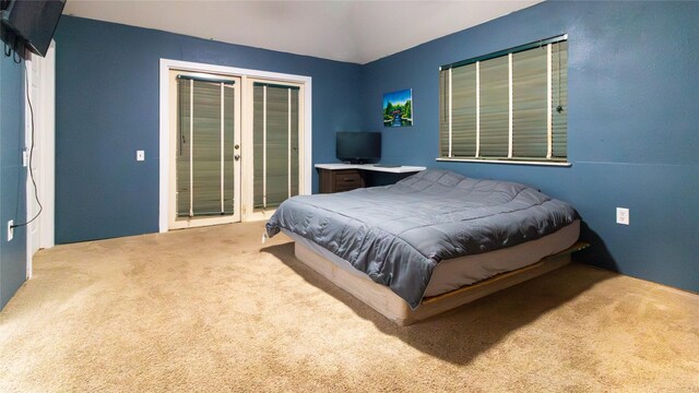 bedroom featuring carpet flooring and french doors