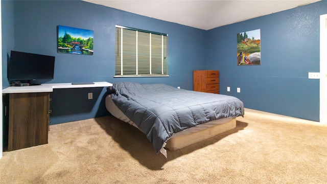 bedroom with light carpet