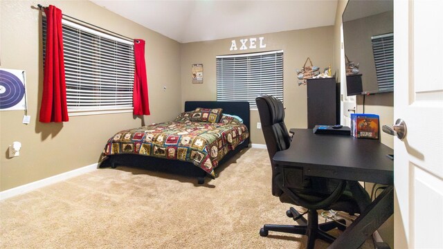 bedroom featuring carpet and lofted ceiling