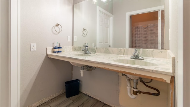 bathroom featuring dual sinks