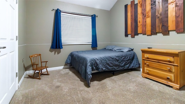 bedroom featuring light carpet and lofted ceiling