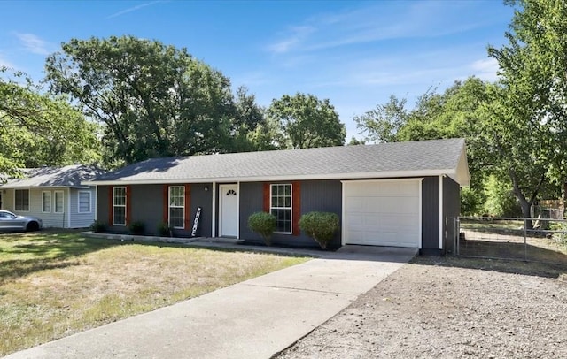 ranch-style house with a garage and a front lawn