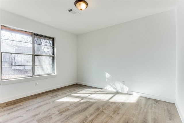 unfurnished room featuring light hardwood / wood-style floors