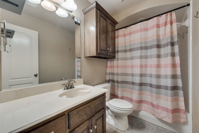 full bathroom featuring shower / tub combo, vanity, and toilet