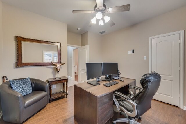 office space featuring light hardwood / wood-style flooring and ceiling fan