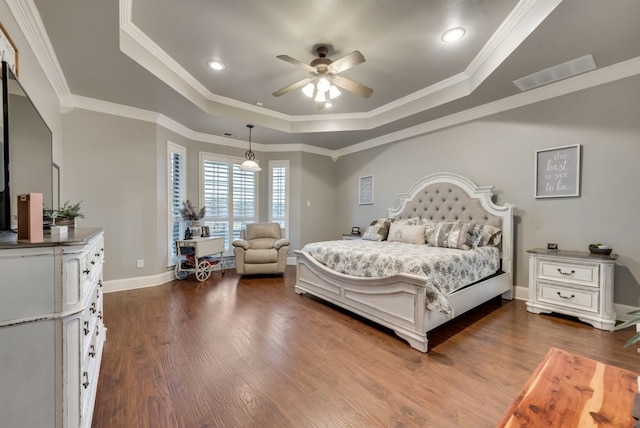 bedroom featuring a raised ceiling, crown molding, ceiling fan, and dark wood-type flooring