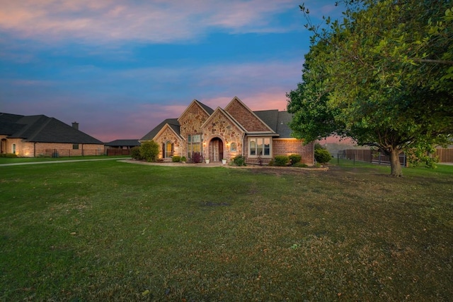 view of front of house with a yard