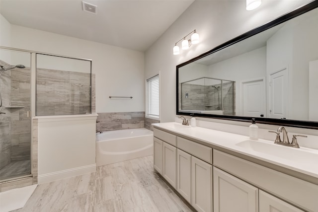 bathroom with hardwood / wood-style floors, shower with separate bathtub, and vanity