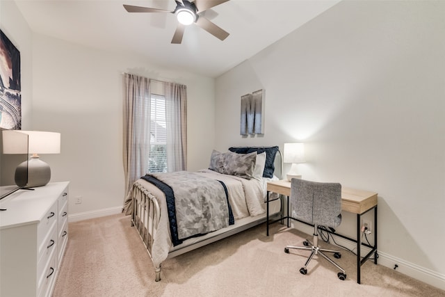 carpeted bedroom featuring vaulted ceiling and ceiling fan