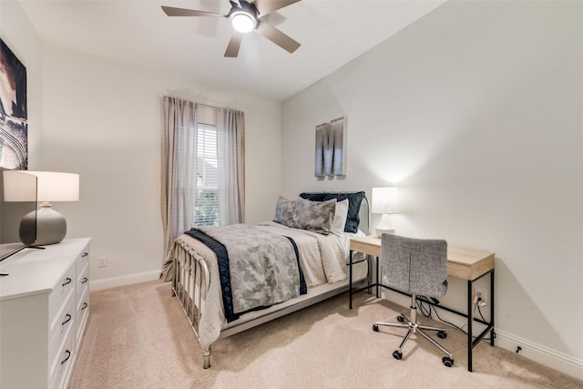 bedroom with light carpet, a ceiling fan, and baseboards