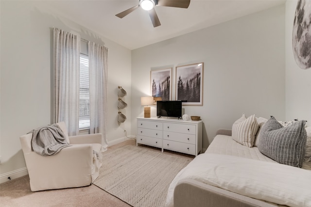 bedroom featuring ceiling fan and light colored carpet