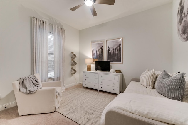 bedroom with baseboards, light carpet, and a ceiling fan