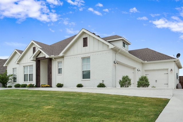 view of front of property with a garage and a front yard