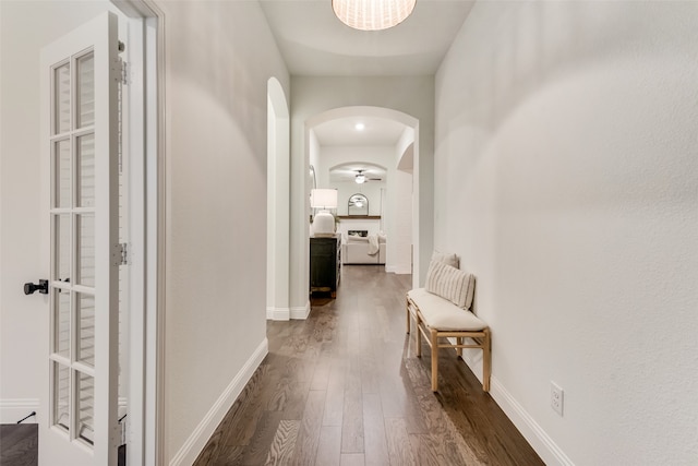 hallway with dark hardwood / wood-style floors