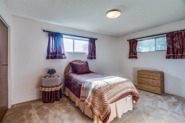 bedroom with light carpet