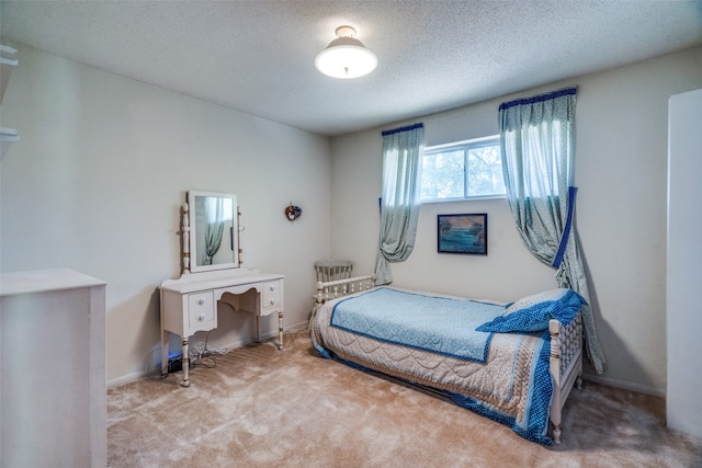 carpeted bedroom with a textured ceiling