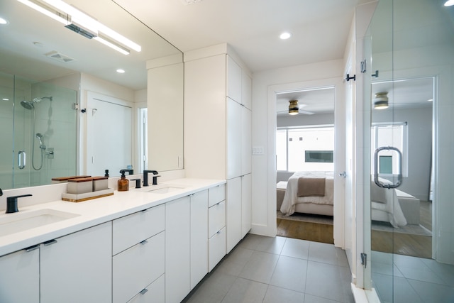 bathroom with walk in shower, vanity, hardwood / wood-style flooring, and ceiling fan