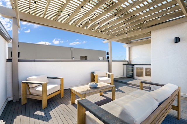 deck featuring a pergola and an outdoor living space