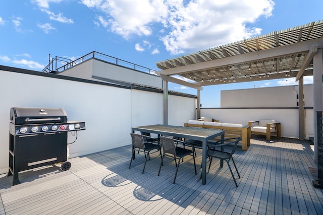 wooden terrace with a grill and a pergola