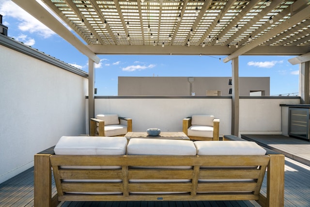 view of patio / terrace featuring a wooden deck and a pergola