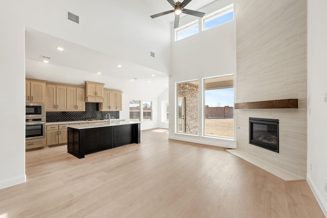 kitchen featuring plenty of natural light, appliances with stainless steel finishes, and open floor plan