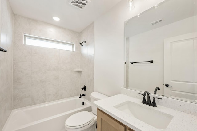 bathroom with toilet, shower / bath combination, vanity, and visible vents