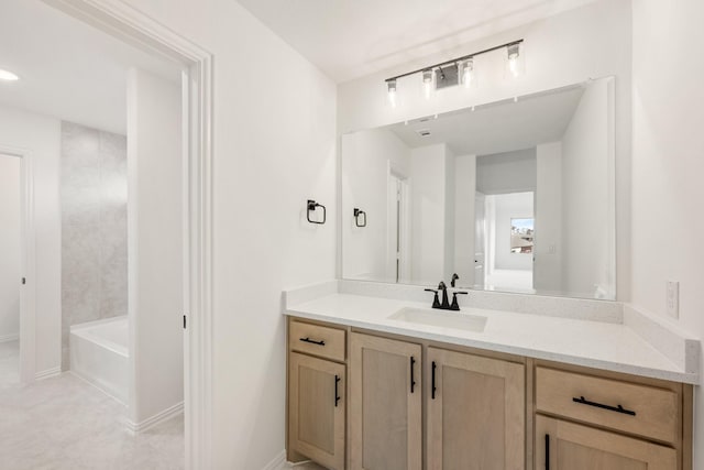 bathroom with shower / tub combination, vanity, and baseboards