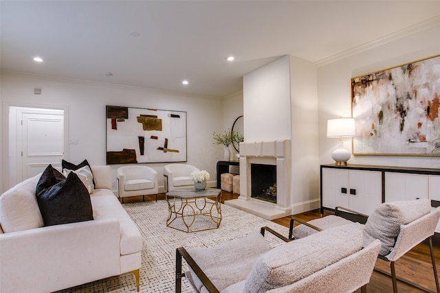 living room with hardwood / wood-style floors and ornamental molding