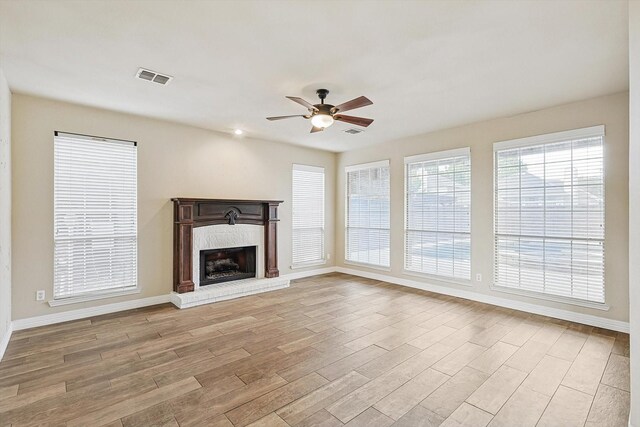 living room featuring ceiling fan and light hardwood / wood-style floors