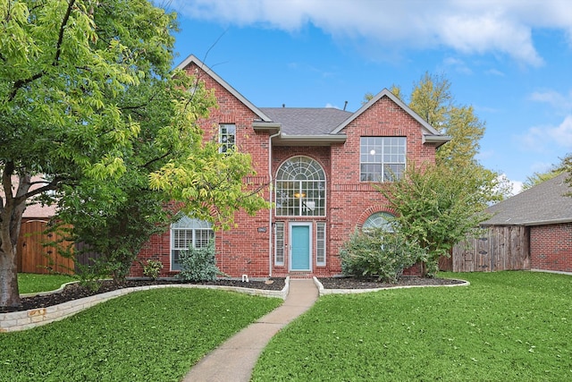 front facade featuring a front yard