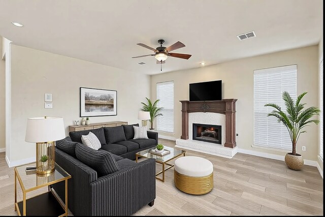 unfurnished room with french doors, ceiling fan, light hardwood / wood-style flooring, and a textured ceiling