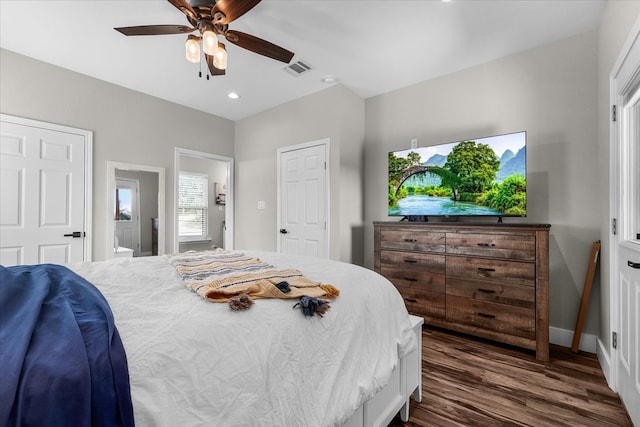 bedroom with ceiling fan and dark hardwood / wood-style floors