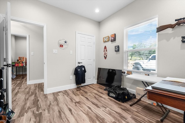 office space with light hardwood / wood-style flooring