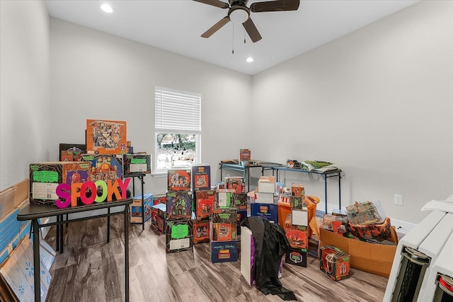 recreation room featuring hardwood / wood-style flooring and ceiling fan