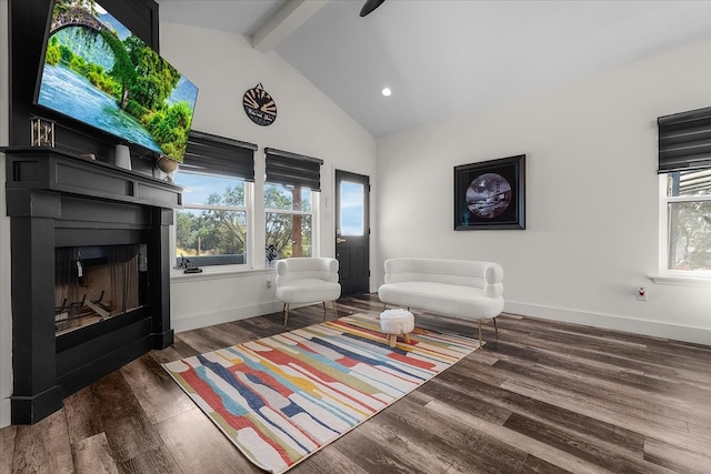 unfurnished living room featuring dark hardwood / wood-style floors and lofted ceiling with beams