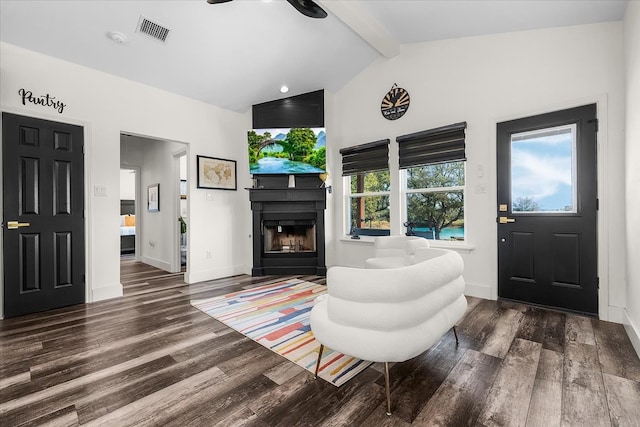 living room with lofted ceiling with beams and dark hardwood / wood-style flooring