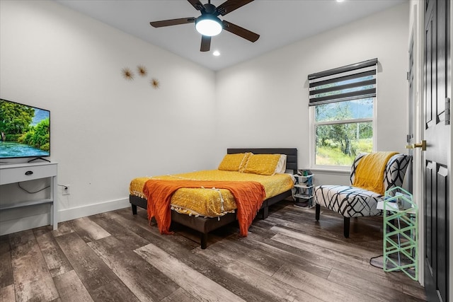 bedroom featuring ceiling fan and dark hardwood / wood-style flooring