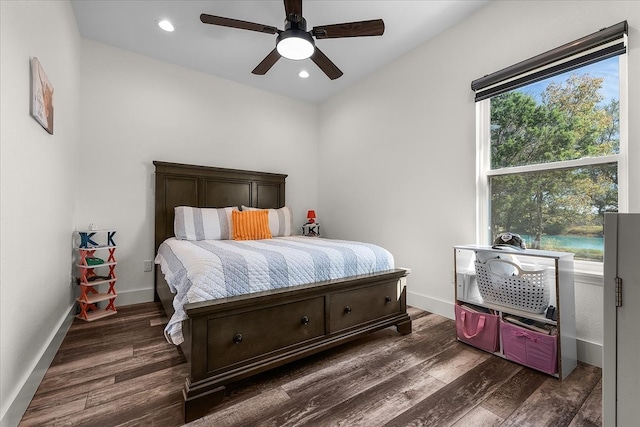 bedroom with dark wood-type flooring and ceiling fan