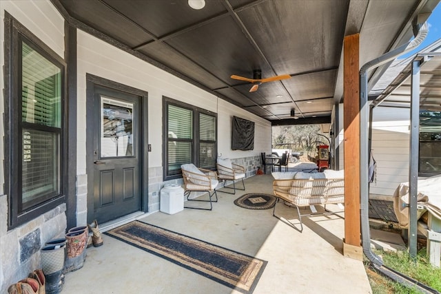 view of patio featuring ceiling fan